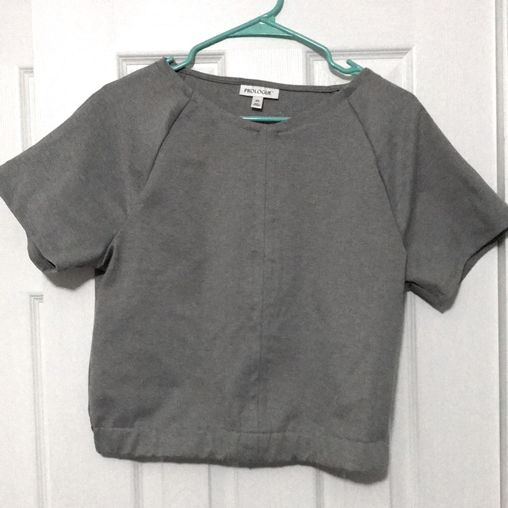 Grey shirt.